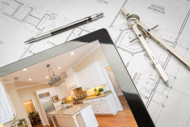 Computer Tablet Showing Finished Kitchen Sitting On House Plans With Pencil and Compass.http://www.feverpitchpro.com/istockphoto/stock-photo-moving-relocating-lightbox.jpg